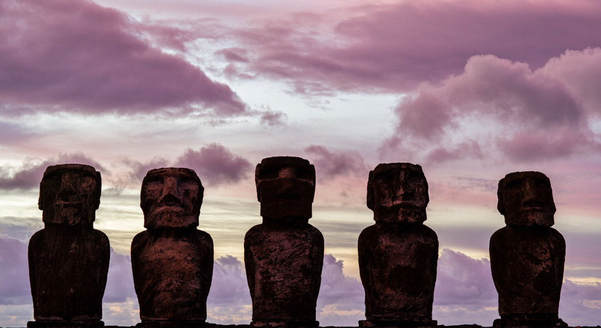 Moai of Easter Island (Rapa Nui) during a colorful sunrise.